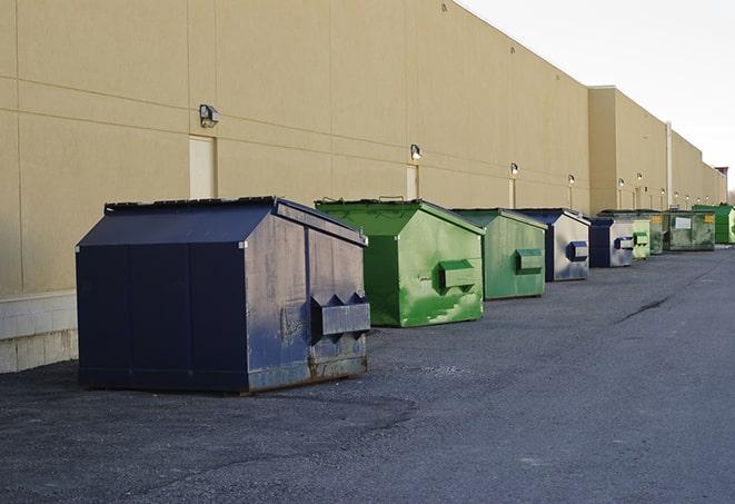 a large dumpster awaits materials from a renovation project in Hannibal